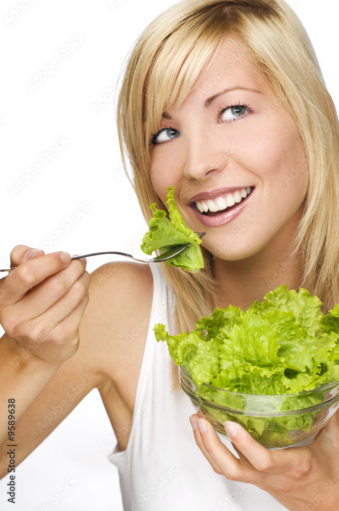 young attractive woman eating salad close up young attractive woman eating salad close up