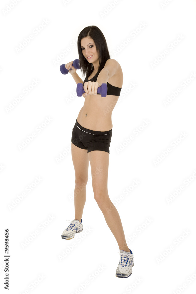 Beautiful Caucasian woman working out with dumbbells Beautiful Caucasian woman working out with dumbbells