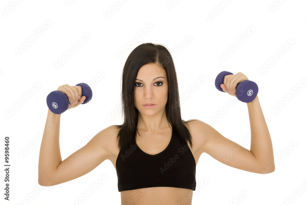 Beautiful Caucasian woman working out with dumbbells Beautiful Caucasian woman working out with dumbbells