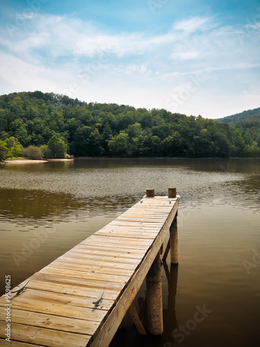 Wooden Dock Overlooking Peaceful Mountain Lake