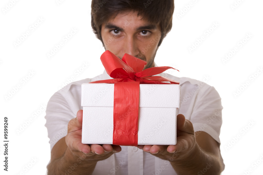young man with a wrapped gift box for you (selective focus) young man with a wrapped gift box for you (selective focus)