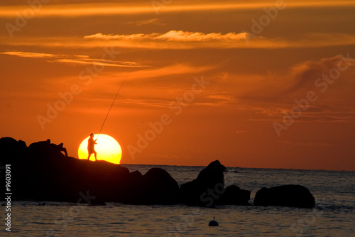 pêcheur couché de soleil