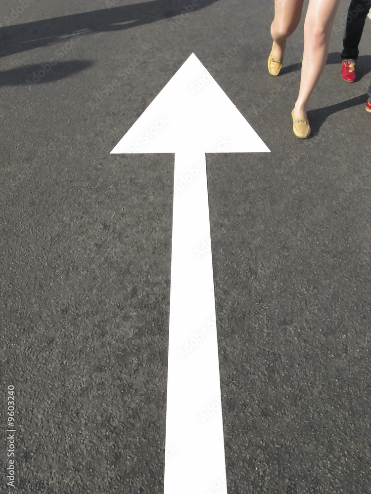 Index marking on road and legs of going people