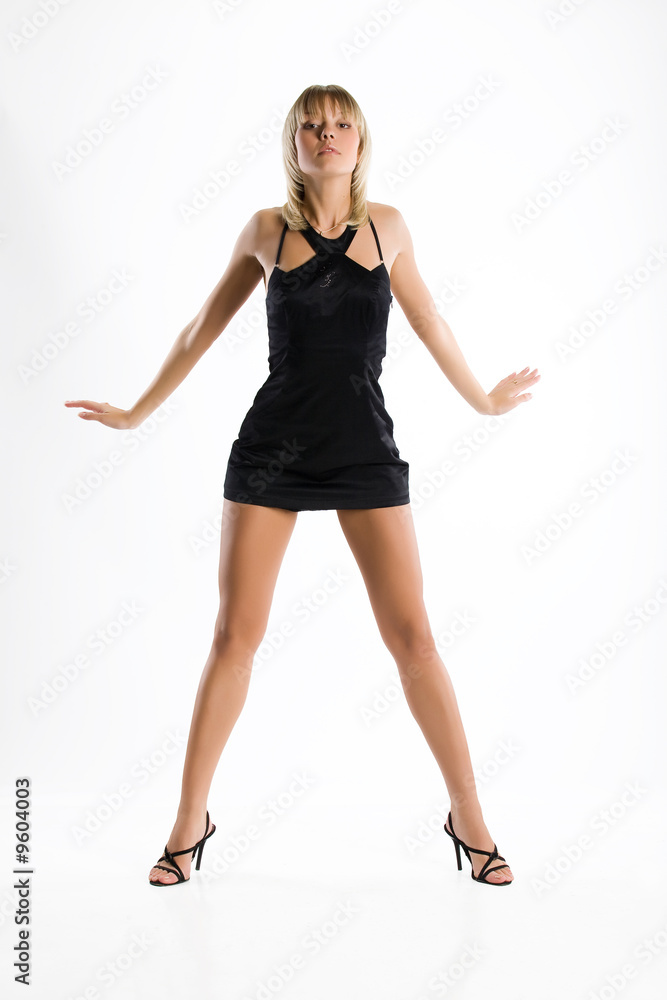 Fototapeta premium Young emotional woman in short black dress