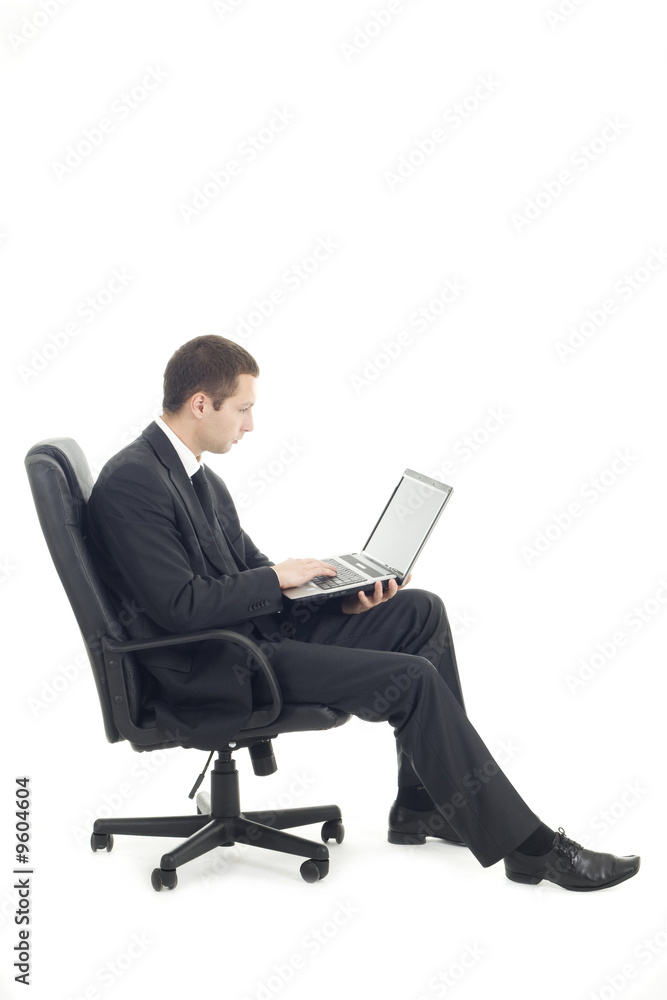 Young businessman sitting with laptop Young businessman sitting with laptop