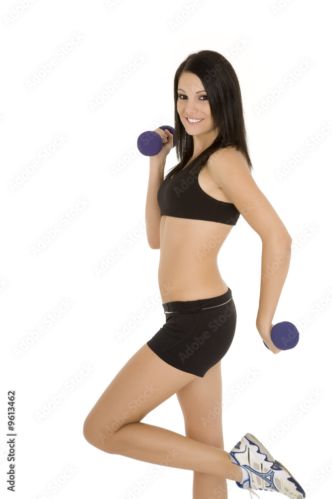 Beautiful Caucasian woman working out with dumbbells Beautiful Caucasian woman working out with dumbbells