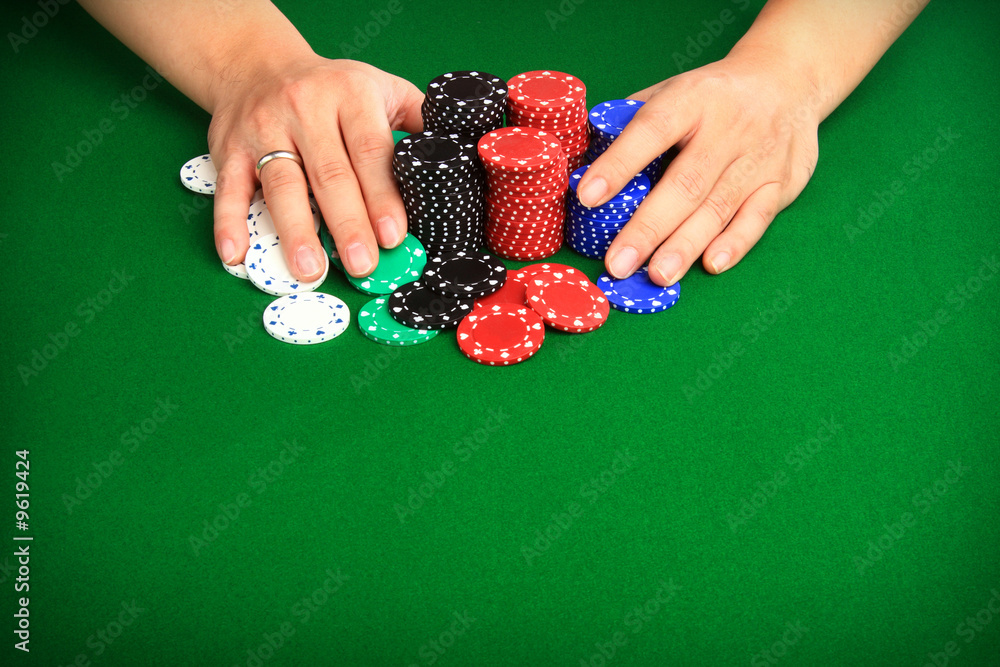 Fototapeta premium Player pushing chips into the pot going 