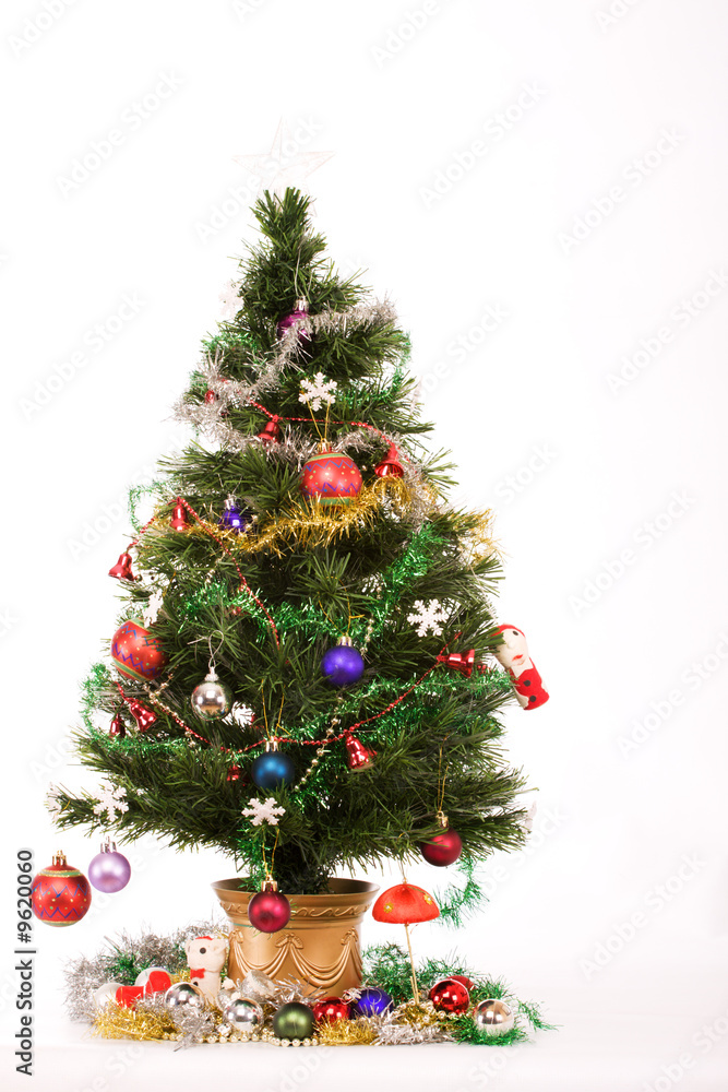 Decorated Christmas tree with a white star on top Decorated Christmas tree with a white star on top
