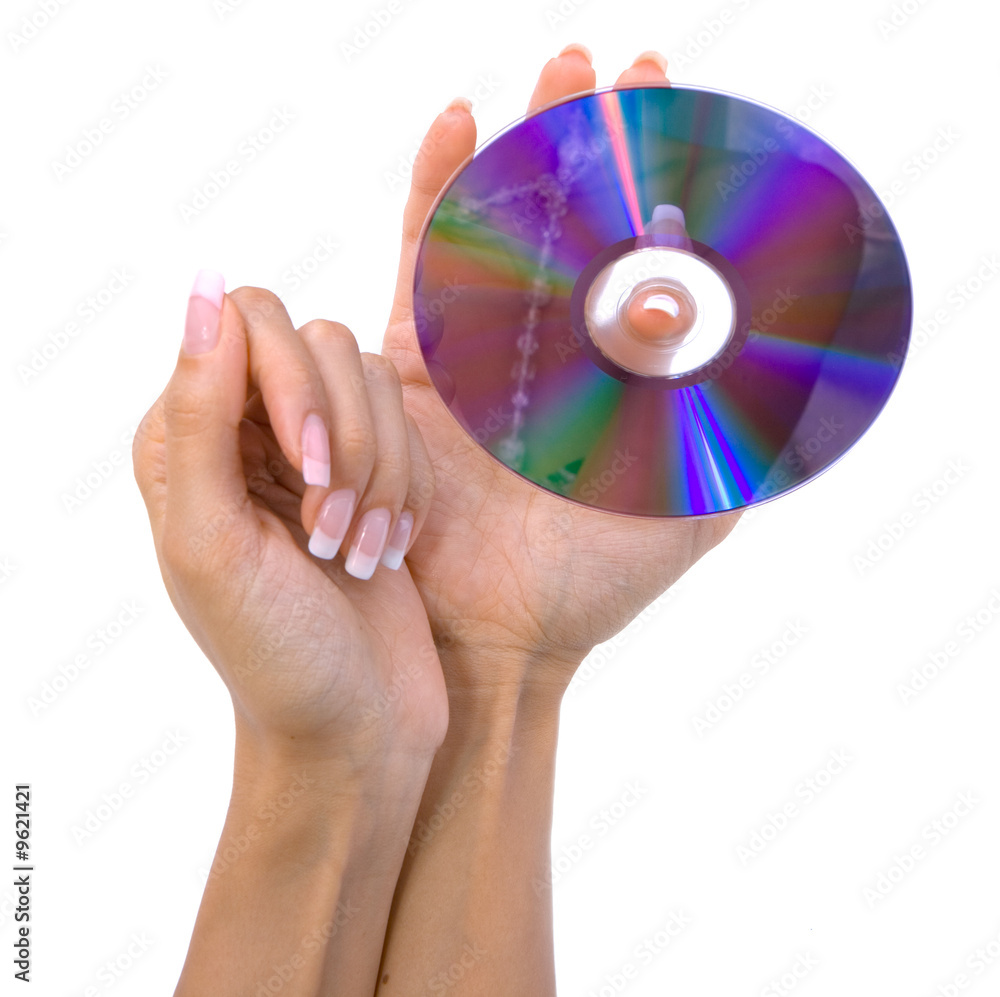 Female hand hold DVD isolated on white Female hand hold DVD isolated on white