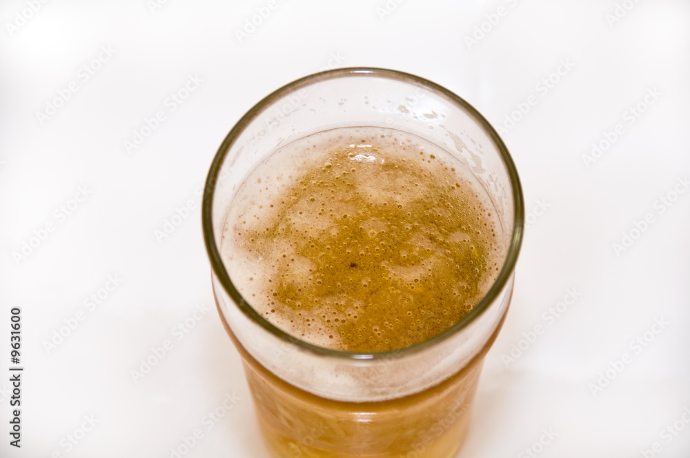 A pint of beer isolated on a white background A pint of beer isolated on a white background