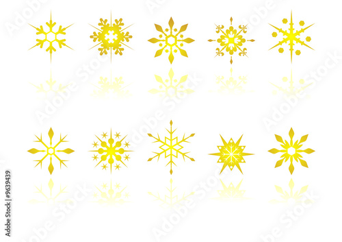 Golden snow crystals with reflection over white background © Pedro Nogueira
