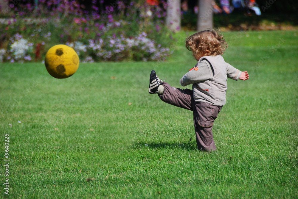 a baby playing football Stock Photo | Adobe Stock