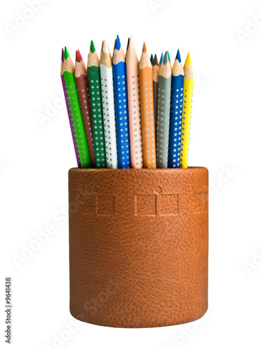 Colored pencils on a leather holder. Clipping path included. photo