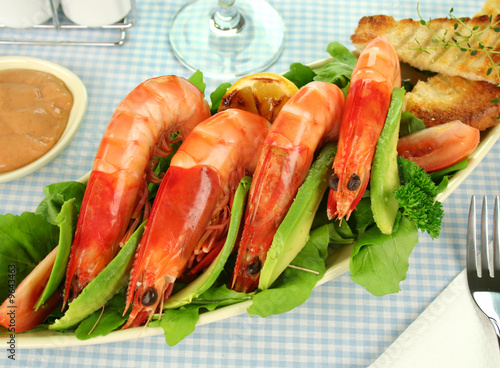 Freshly prepared shrimps with rocket salad
