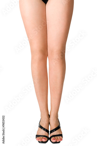 Female legs in black shoes