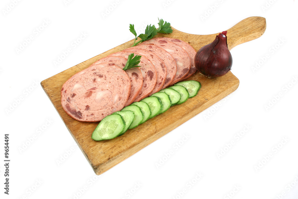 sliced salami with vegetable on wooden board sliced salami with vegetable on wooden board