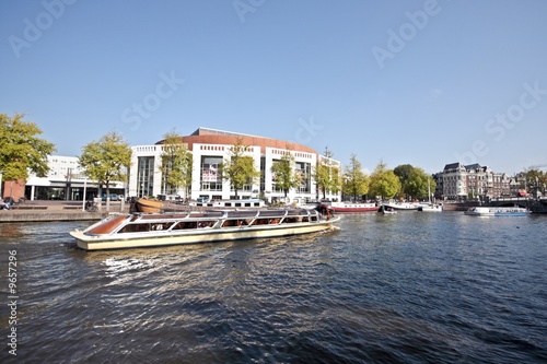 Cruising on the river Amstel in Amsterdam Netherlands photo