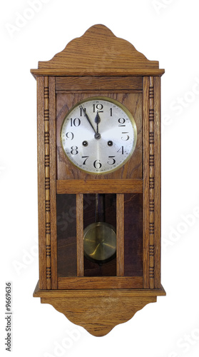 vintage wall clock with pendulum in wooden body