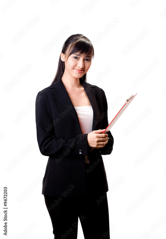 smiling female executive holding a red file smiling female executive holding a red file