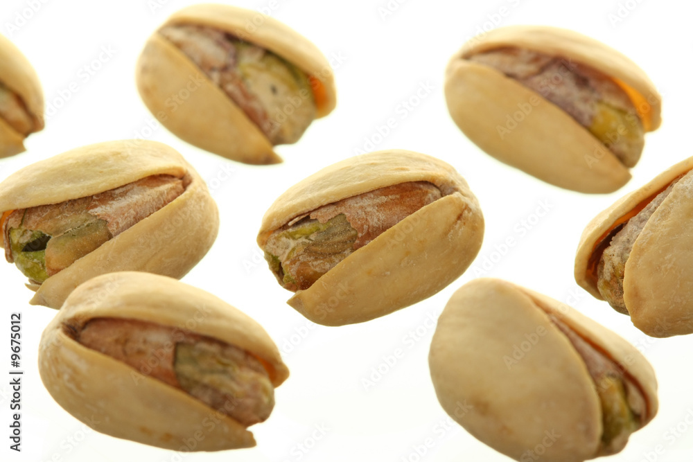 Fototapeta premium Bunch of Pistachios Isolated Against White