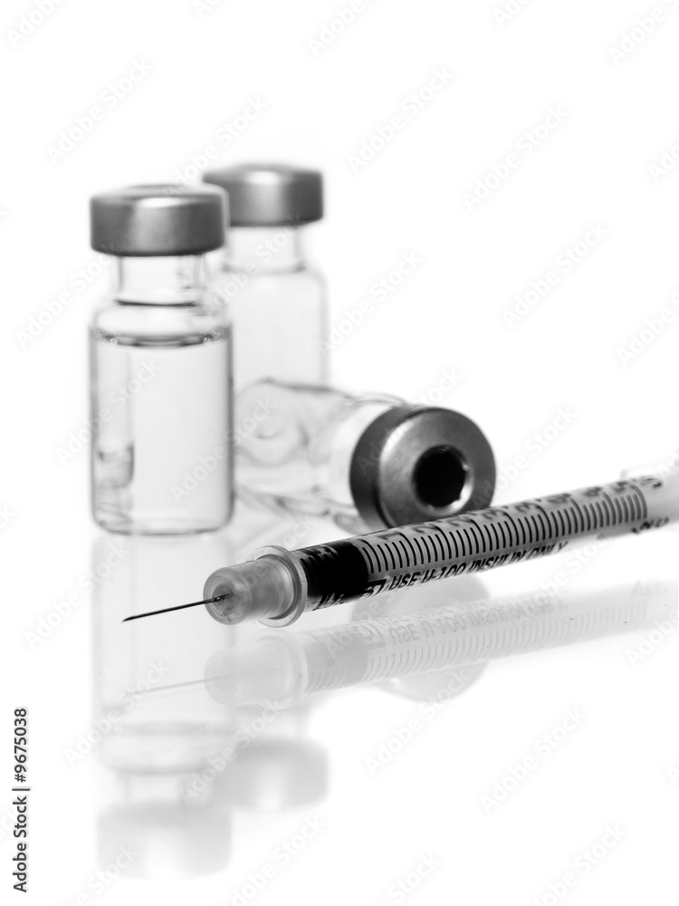 three vials with hypodermic needle three vials with hypodermic needle