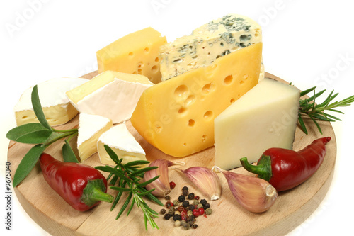 Cheese and herbs on a wooden board. Food photography.