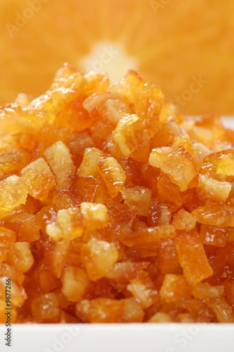 bowl full of orange marmalade and some fresh fruits