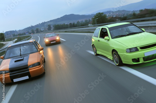 speed fast car racing on highway captured with long exposure