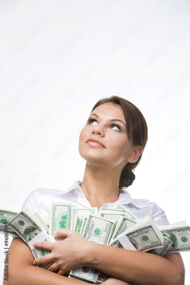 Portrait of charming lady holding bills of dollars Portrait of charming lady holding bills of dollars