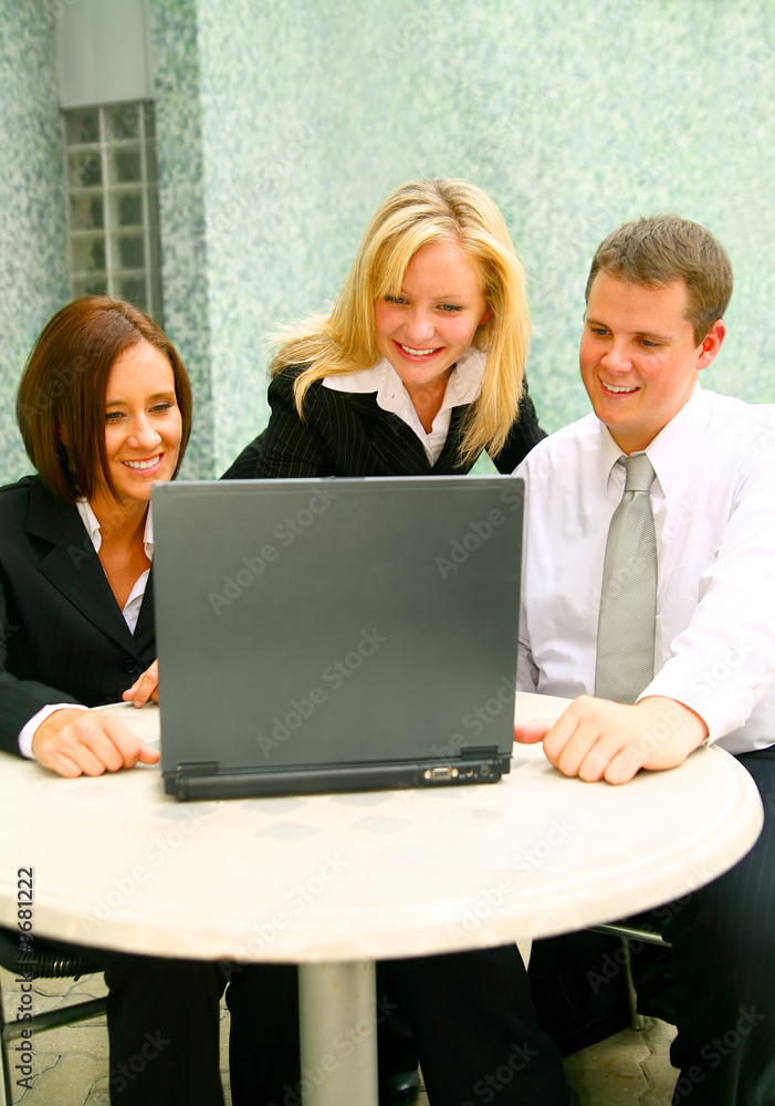 three business people looking at laptop. teamwork three business people looking at laptop. teamwork