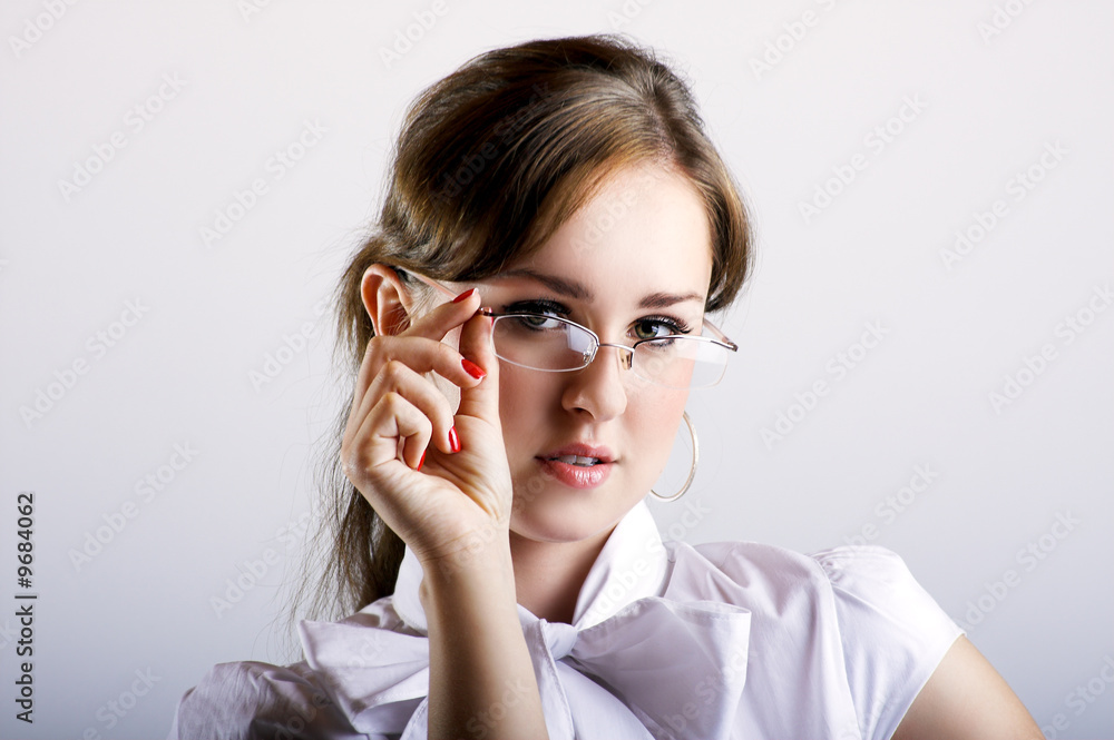 Young beautiful businesswoman with glasses