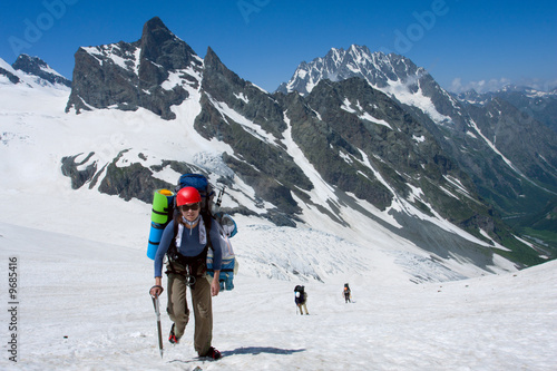 Group of tourist hiking in high mountains