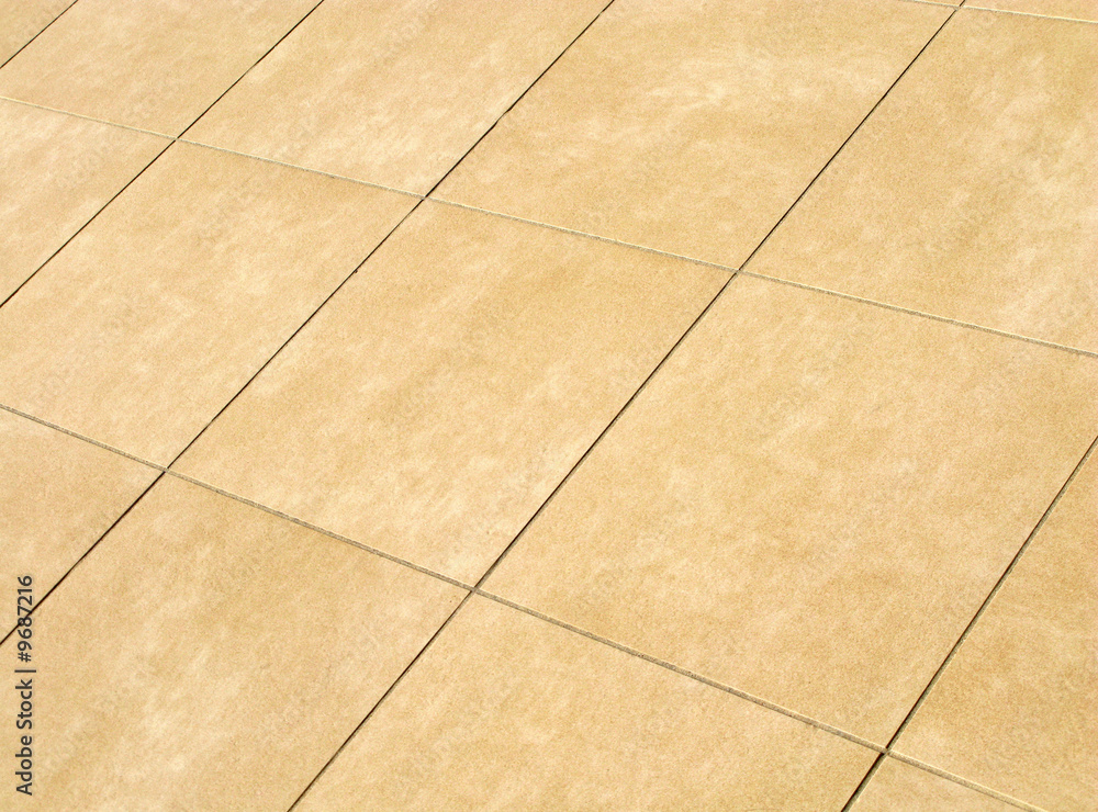 Floor mosaic in beige squares tiles, background
