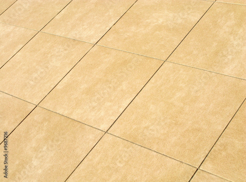 Floor mosaic in beige squares tiles, background