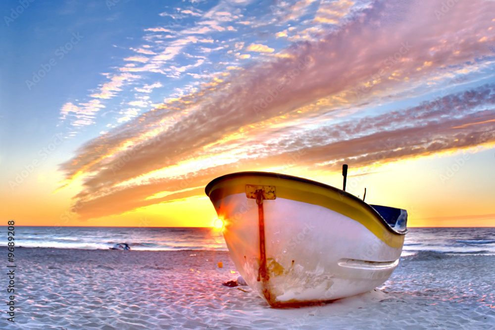 Sky in flames over boat.