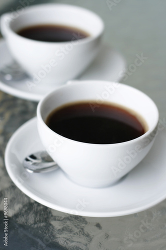 Two cups of black coffee