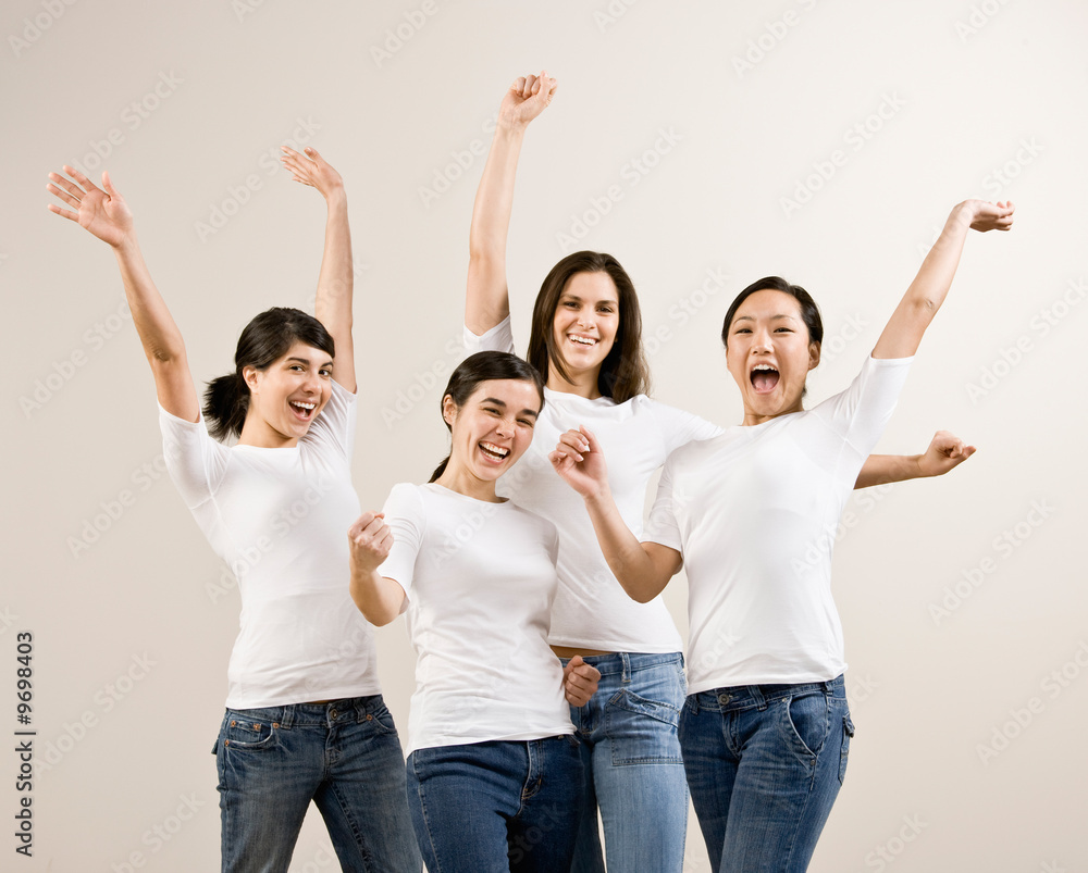 Excited friends cheering and celebrating their success Excited friends cheering and celebrating their success
