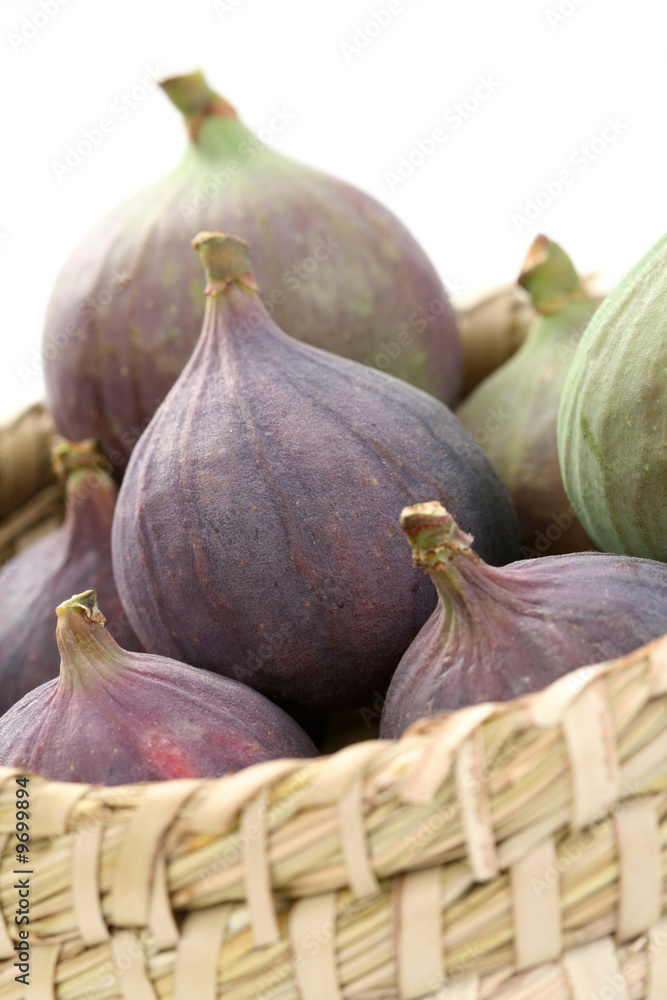 Fototapeta premium basket of fresh figs isolated on white