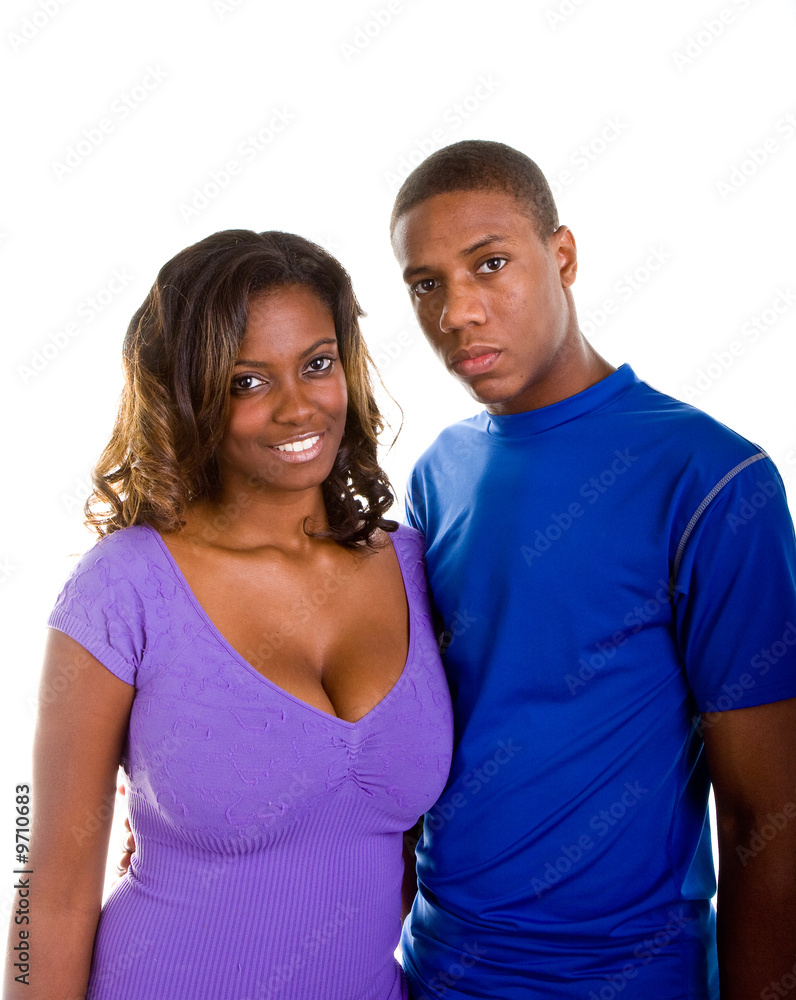 A nice looking young black couple looking at the camera A nice looking young black couple looking at the camera