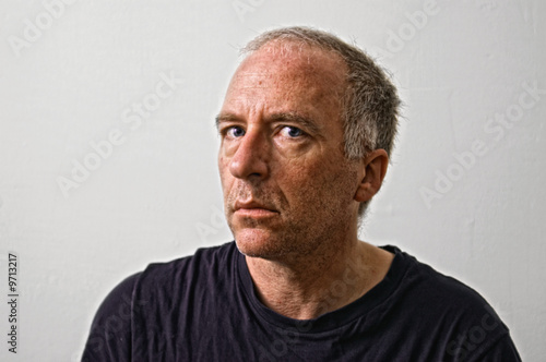 insane looking adult white man staring threateningly