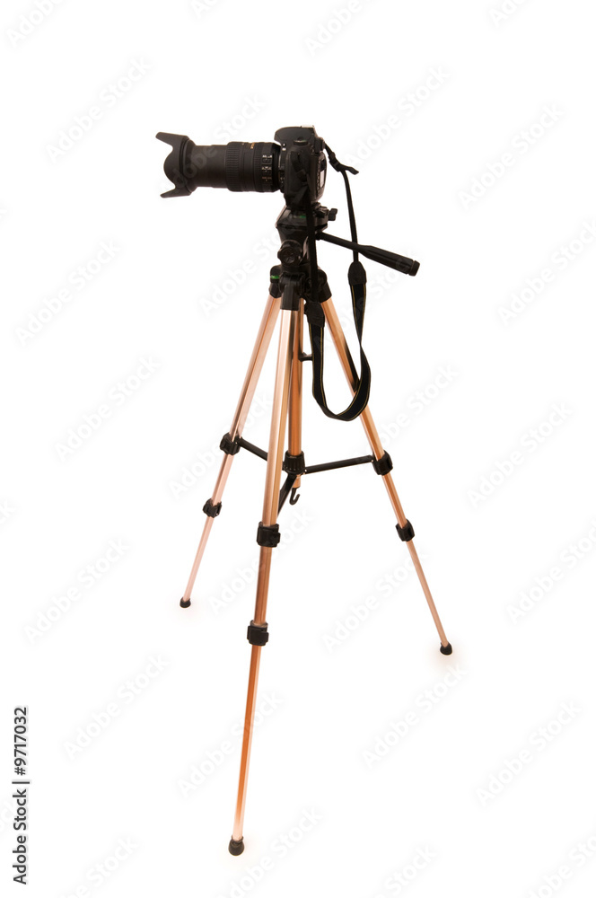 Tripod and camera isolated on the white background Tripod and camera isolated on the white background