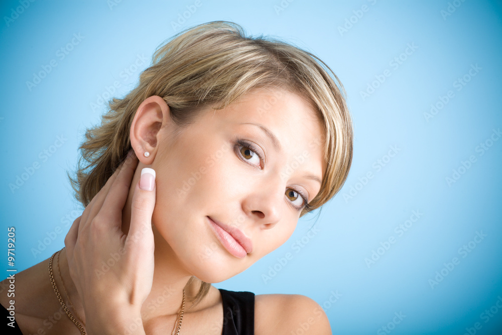Portrait of attractive girl on blue background Portrait of attractive girl on blue background