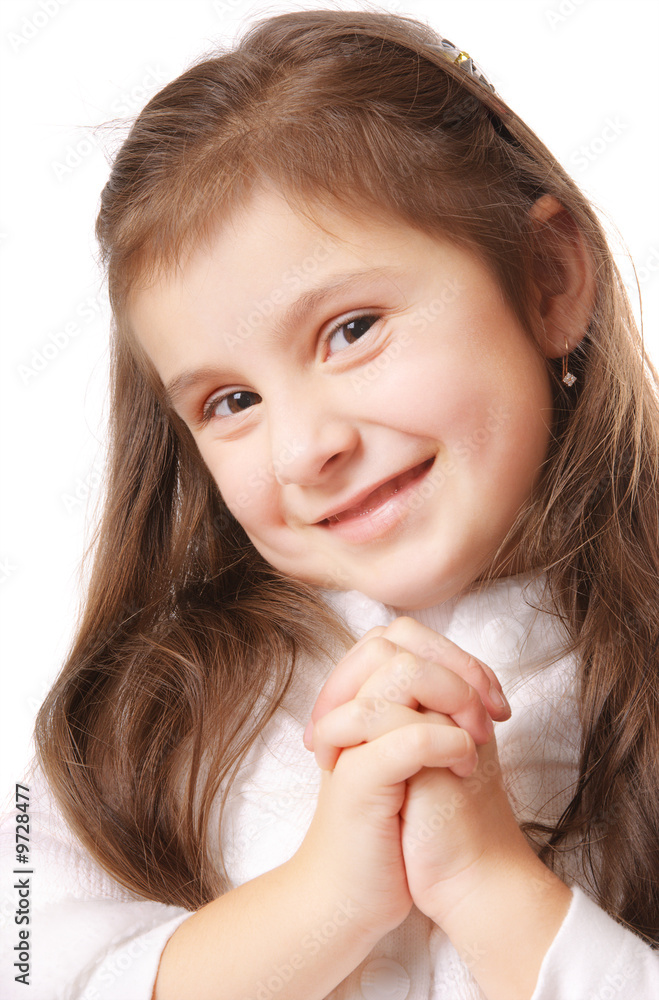 Smiling girl who is thinking or praying. Isolated Smiling girl who is thinking or praying. Isolated