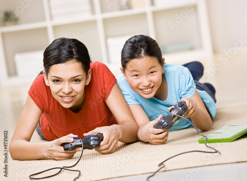 Friends having fun using video game controllers