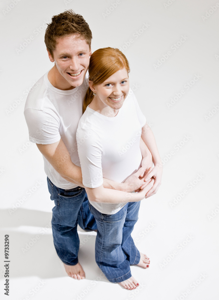 Happy barefoot couple hugging Happy barefoot couple hugging