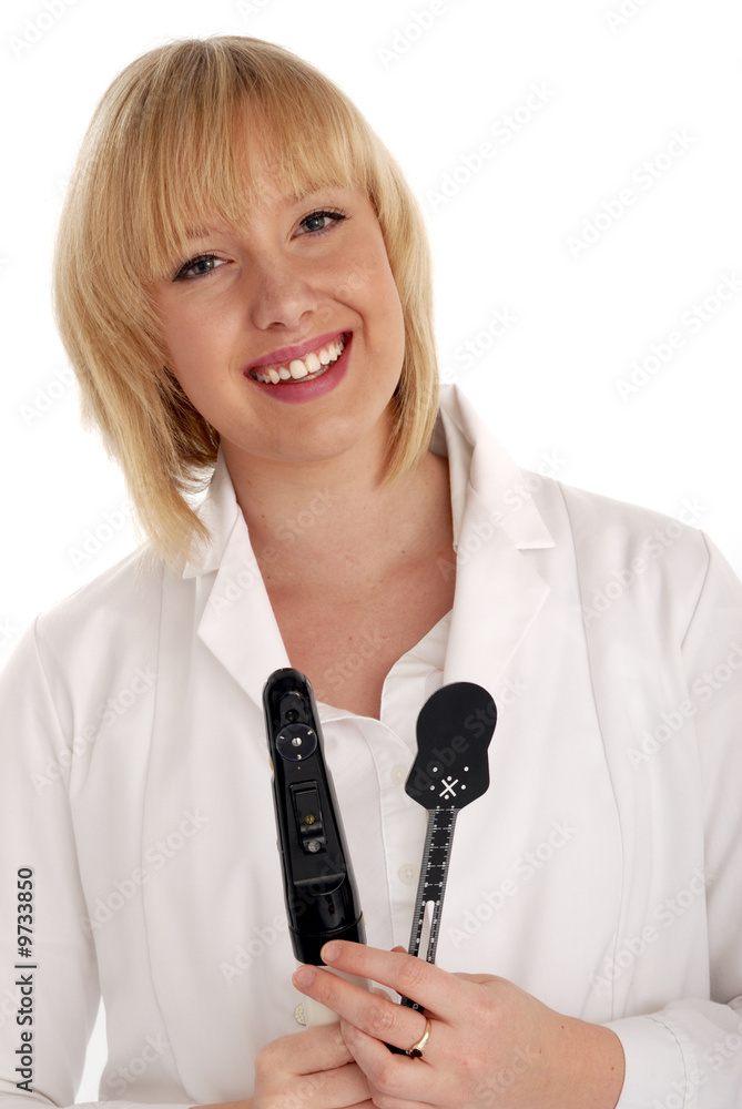 lady optometrist smiling with ophthalmoscope & occluder lady optometrist smiling with ophthalmoscope & occluder