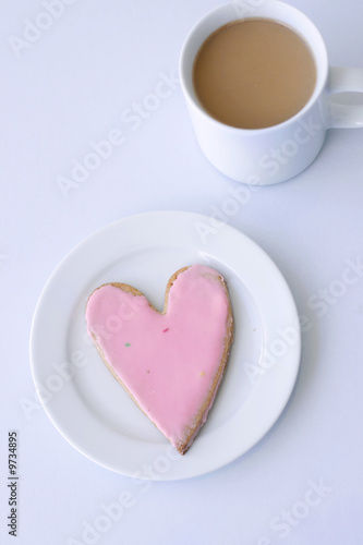 Heart biscuit and a cup of coffee
