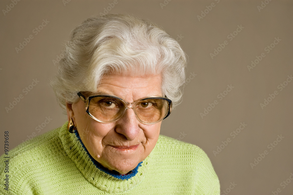 Senior lady portrait, smiling, glasses, with copy space. Senior lady portrait, smiling, glasses, with copy space.