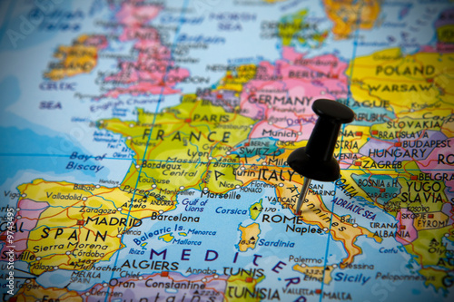 Small pin pointing on Rome (Italy) in a map of Europe