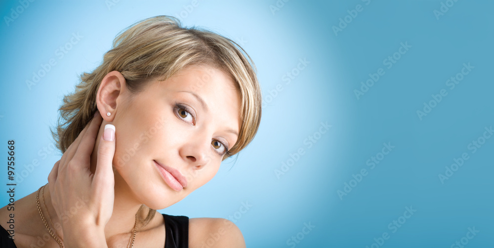 Portrait of attractive girl over blue background with copyspace Portrait of attractive girl over blue background with copyspace